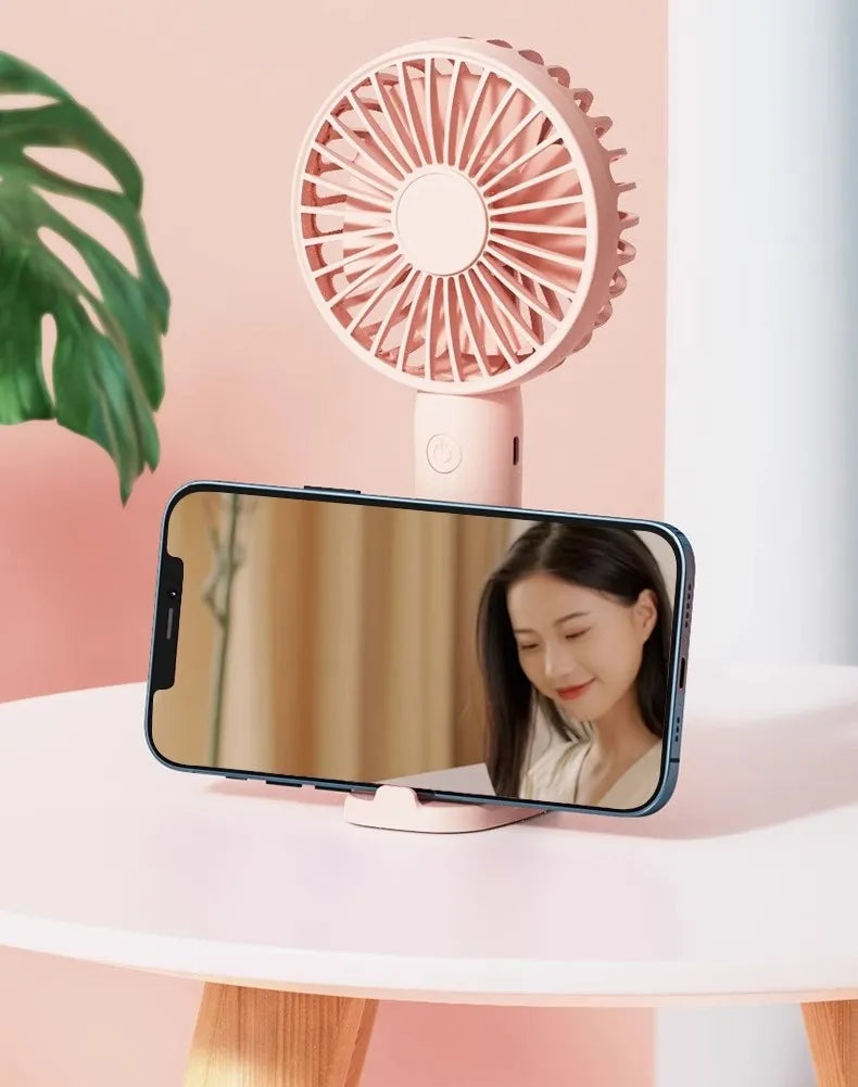 AeroBreeze Handheld Fan — Pocket Cooling & Phone Stand