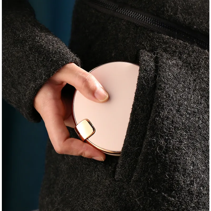 AeroCompact Mirror Hand Warmer and Power Bank, in use